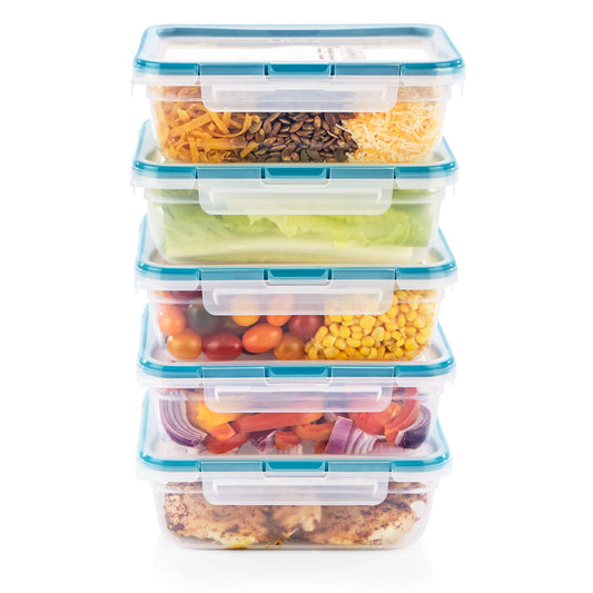 Stack of food storage containers with various foods inside on a white background