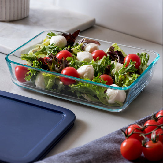 Glass container with salad on a kitchen counter