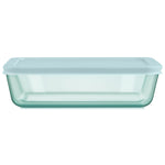 Light blue glass container with lid on a white background