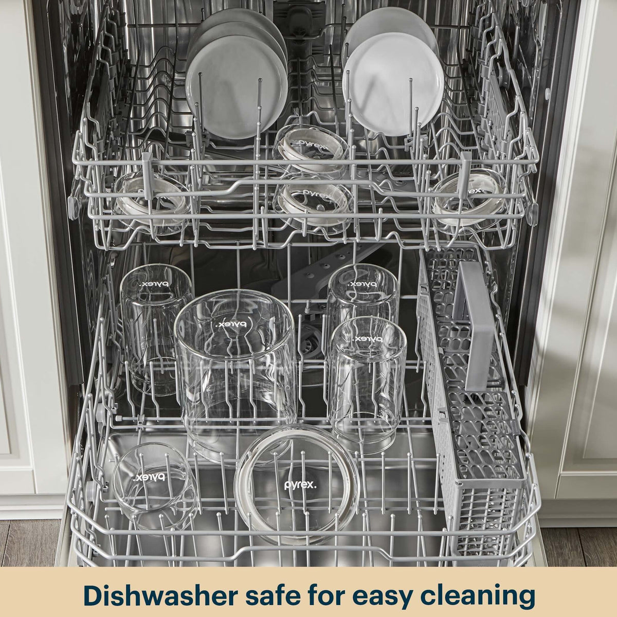 Dishwasher with clean dishes inside, featuring the brand 'Pyrex'.