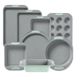 Set of gray silicone baking molds with green accents on a white background