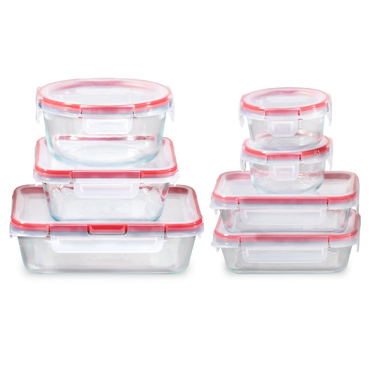 Set of glass food storage containers with red lids on a white background