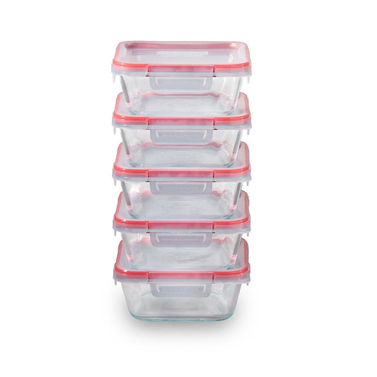 Set of clear food storage containers with pink lids on a white background